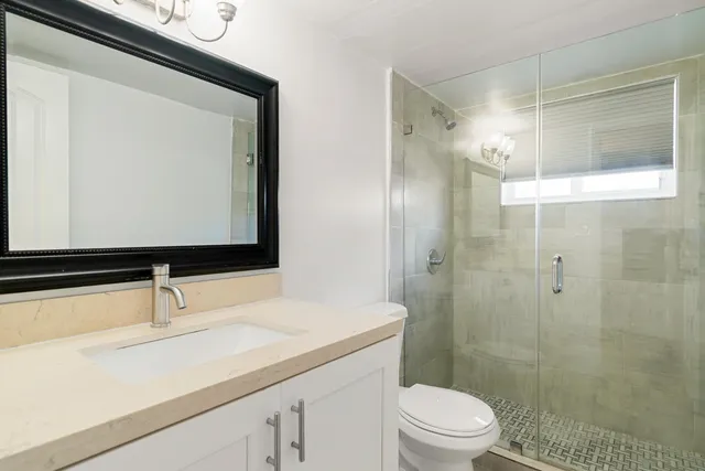 an aerial view of a house with a yard and garden