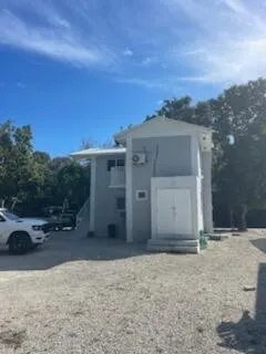 a kitchen with stainless steel appliances granite countertop white cabinets a sink and a stove