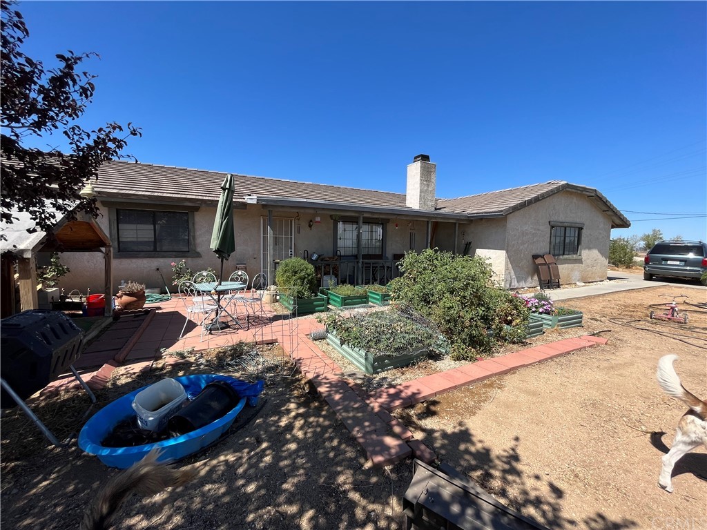 3675 Sunnyslope Road Phelan, CA 92371 - Photo 1 of 1 a view of a house with backyard and sitting area