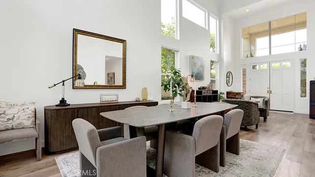 a dining room with furniture and wooden floor