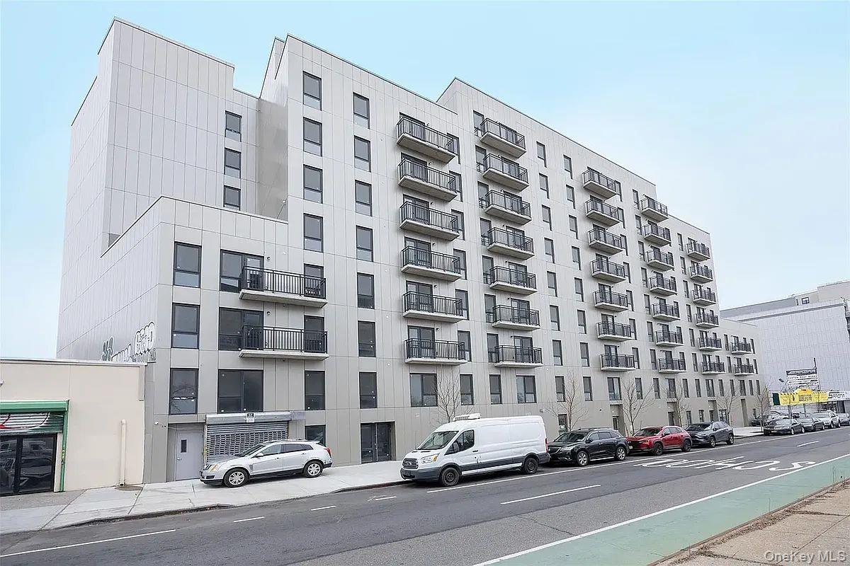 70-40 45th Avenue, Unit 7K Queens, NY 11377 - Photo 2 of 4 View of apartment building / complex