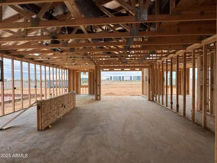 a view of an empty room with a staircase