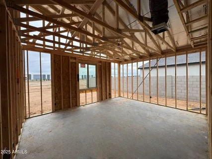 a view of an empty room with a balcony