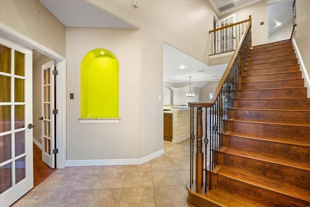 a view of entryway and hall with wooden floor