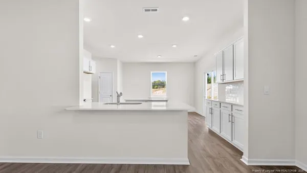 a view of kitchen with wooden floor