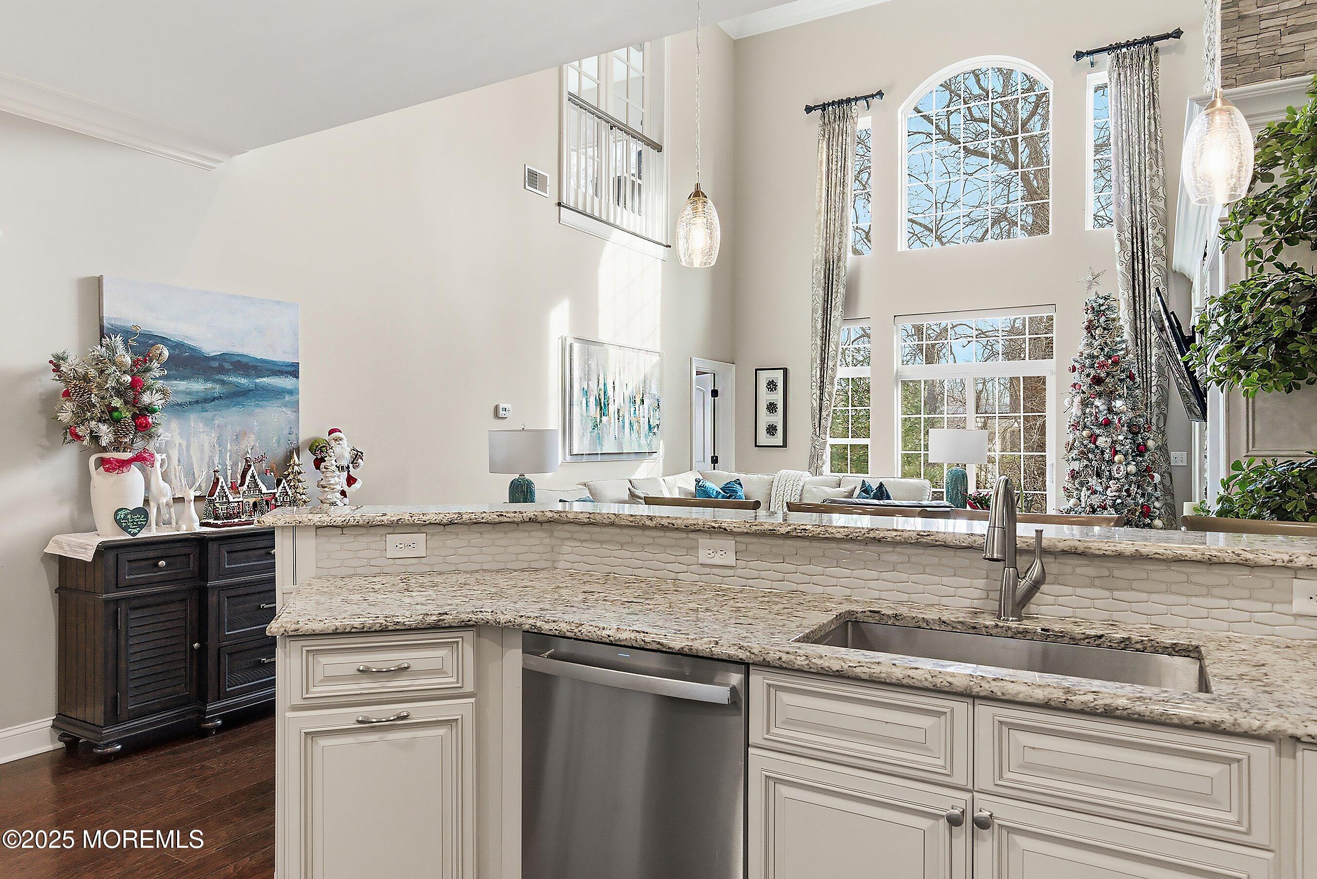 24 Abbey Road Tinton Falls, NJ 07753 - Photo 11 of 52 a kitchen with stainless steel appliances granite countertop a sink and a stove