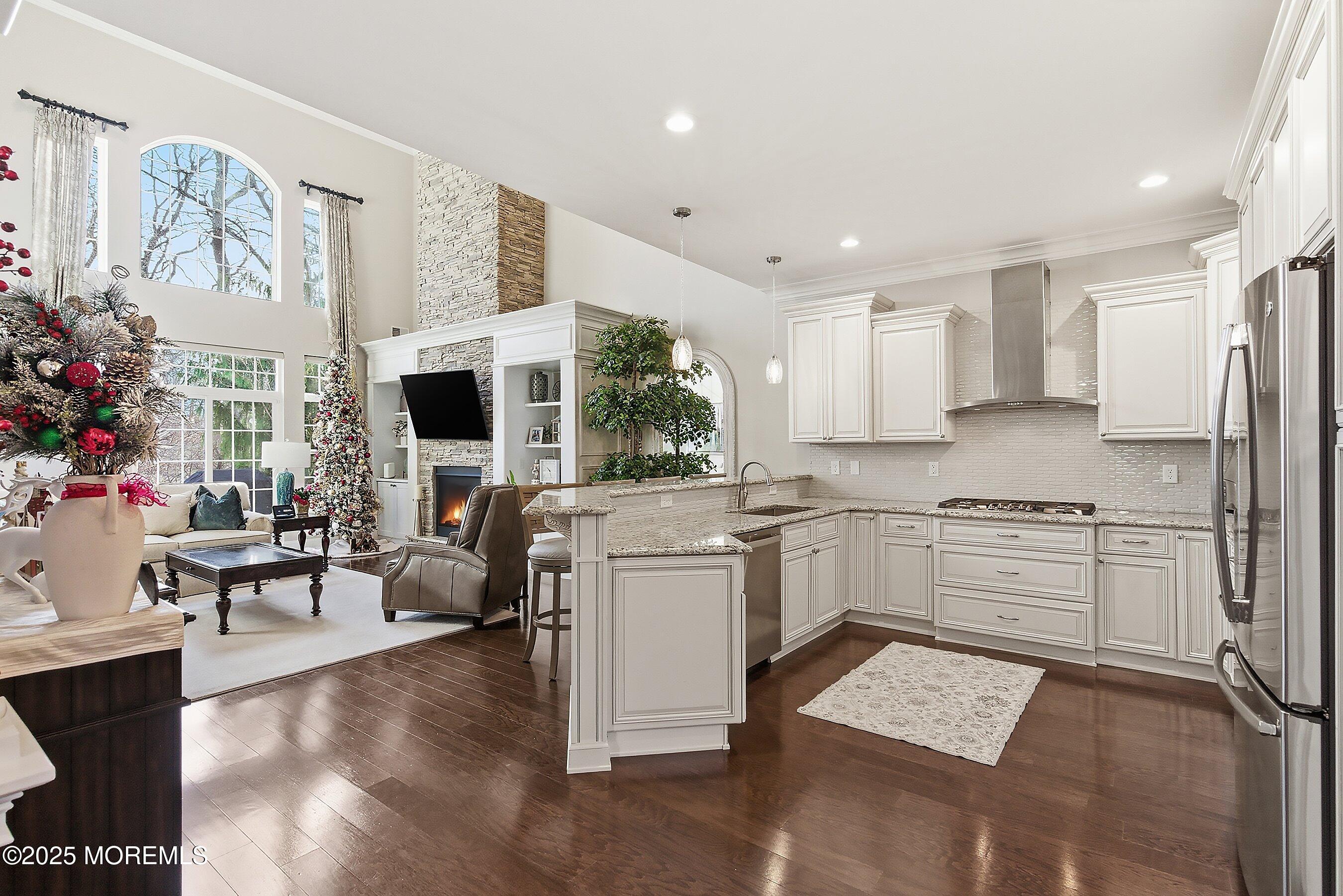 24 Abbey Road Tinton Falls, NJ 07753 - Photo 14 of 52 a kitchen with white cabinets and white appliances