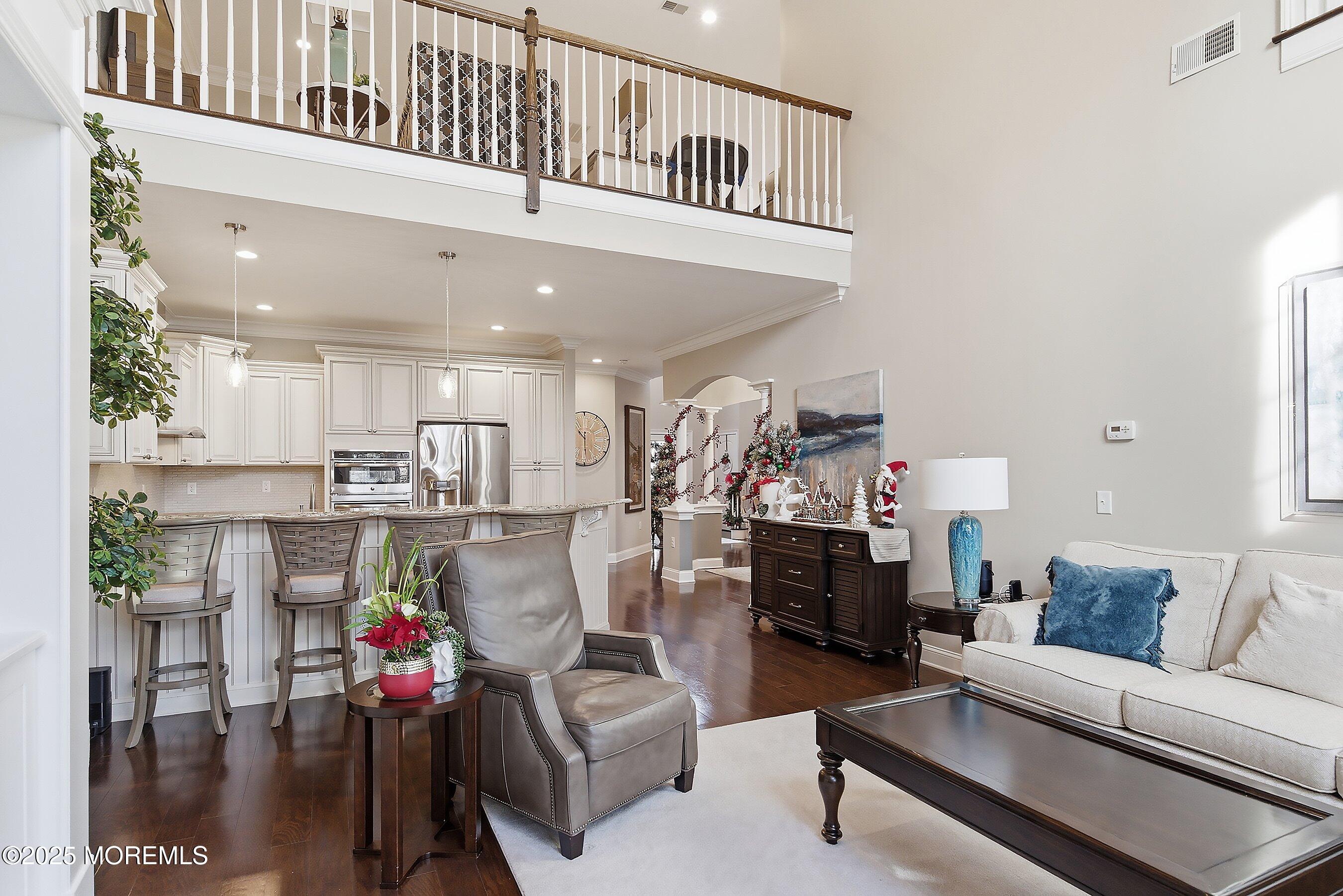24 Abbey Road Tinton Falls, NJ 07753 - Photo 15 of 52 a living room with furniture and kitchen view