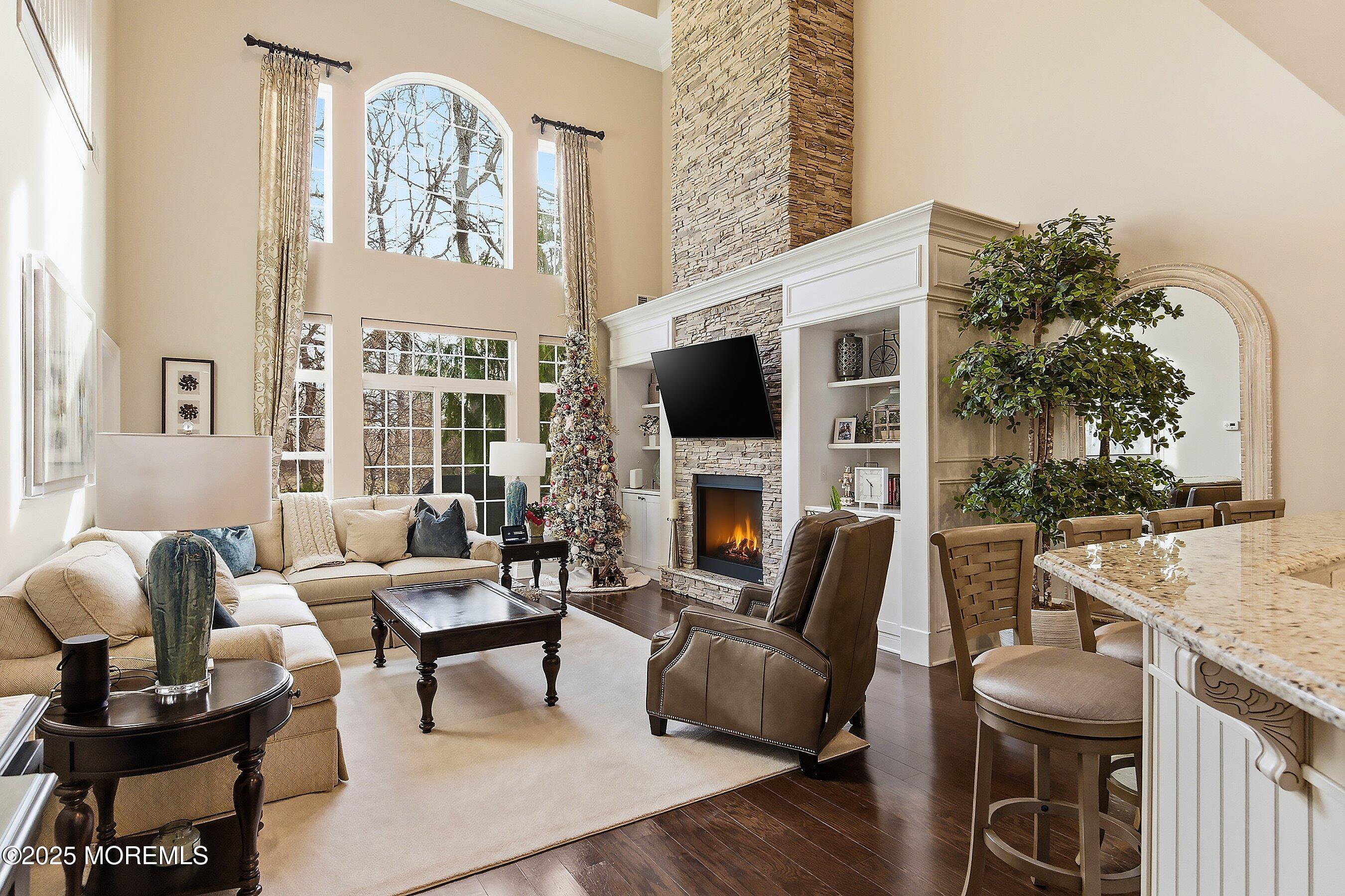 24 Abbey Road Tinton Falls, NJ 07753 - Photo 16 of 52 a living room with furniture fireplace and a large window
