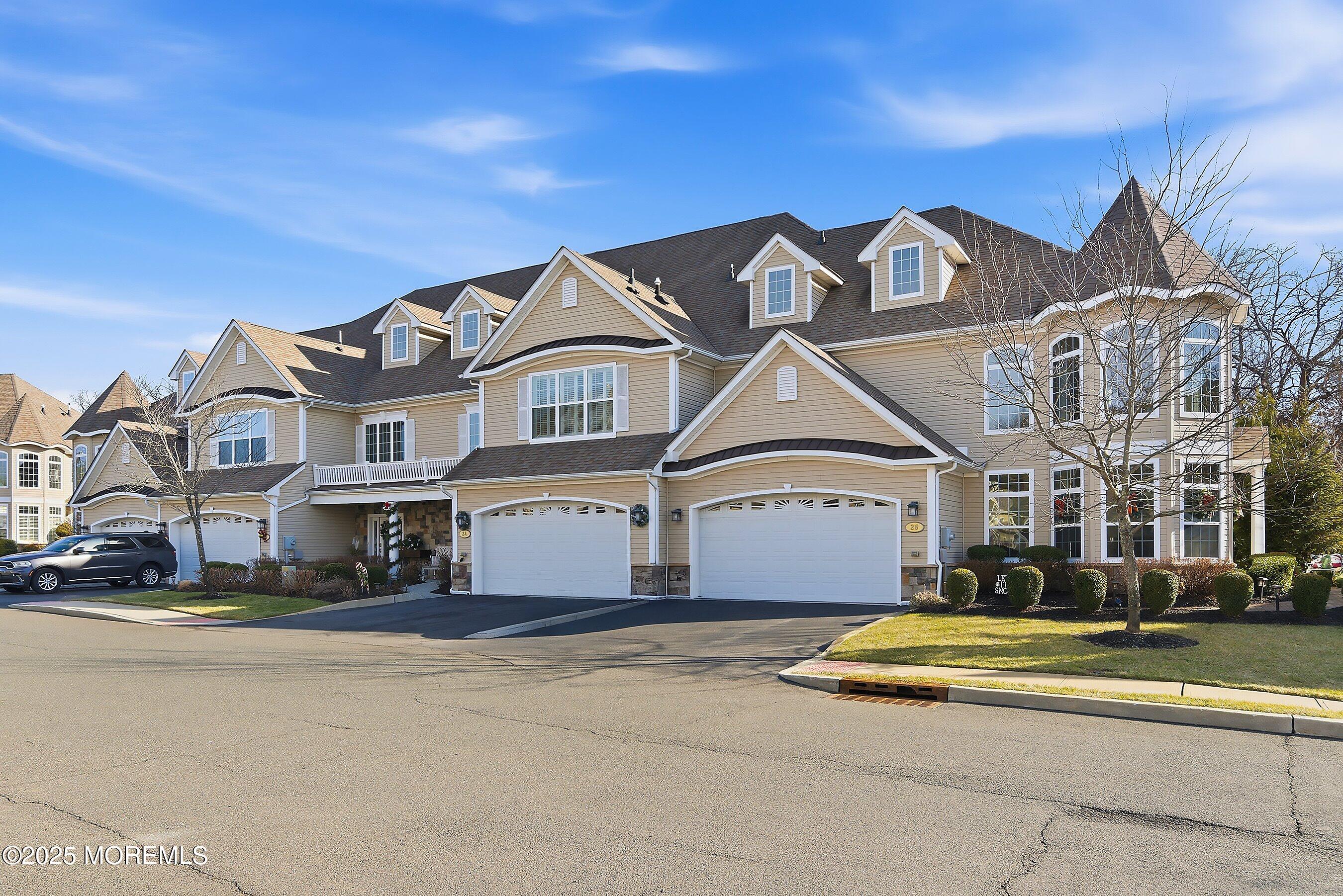 24 Abbey Road Tinton Falls, NJ 07753 - Photo 2 of 52 a front view of a residential houses with buildings