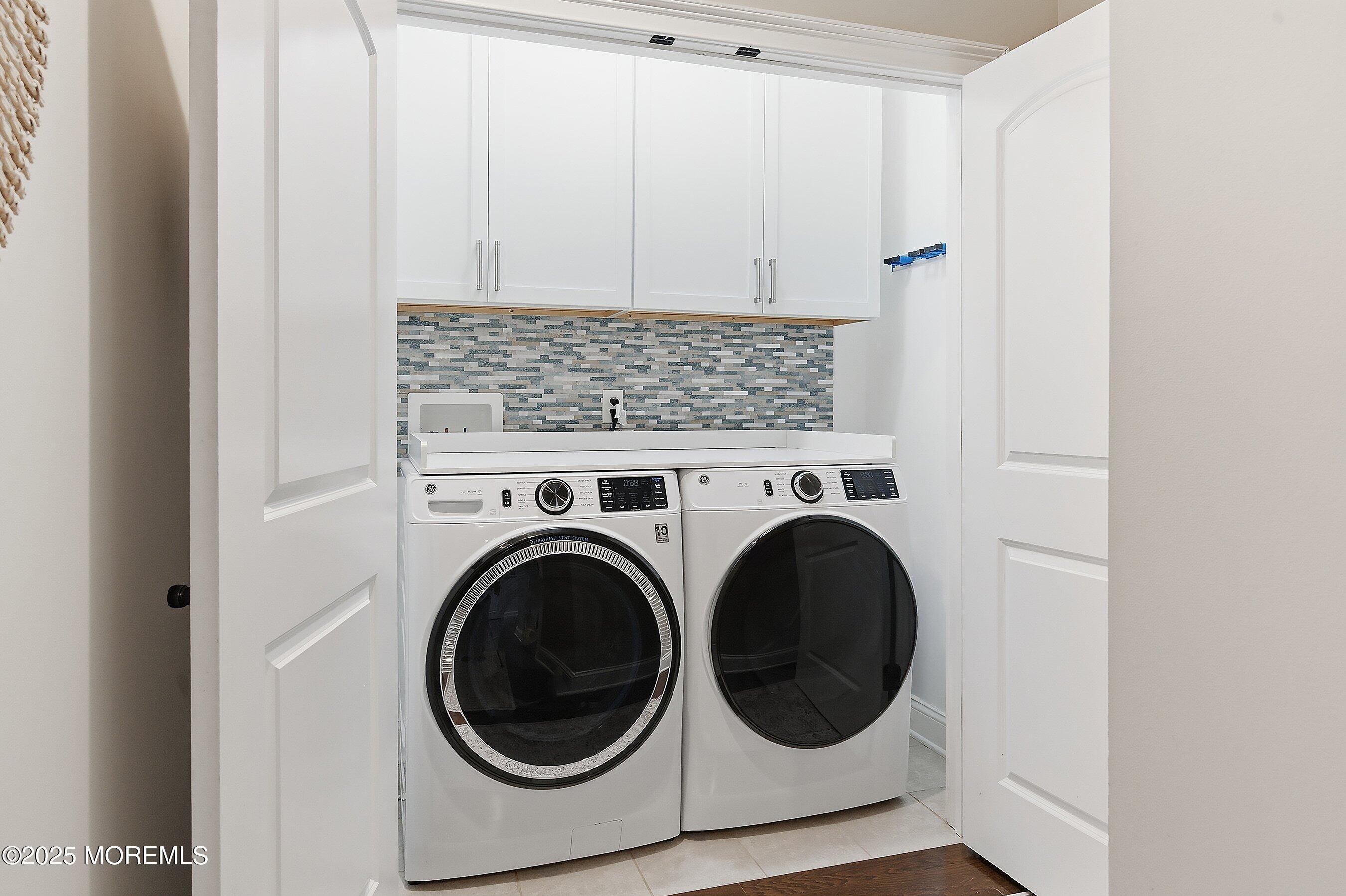 24 Abbey Road Tinton Falls, NJ 07753 - Photo 25 of 52 a utility room with dryer and washer