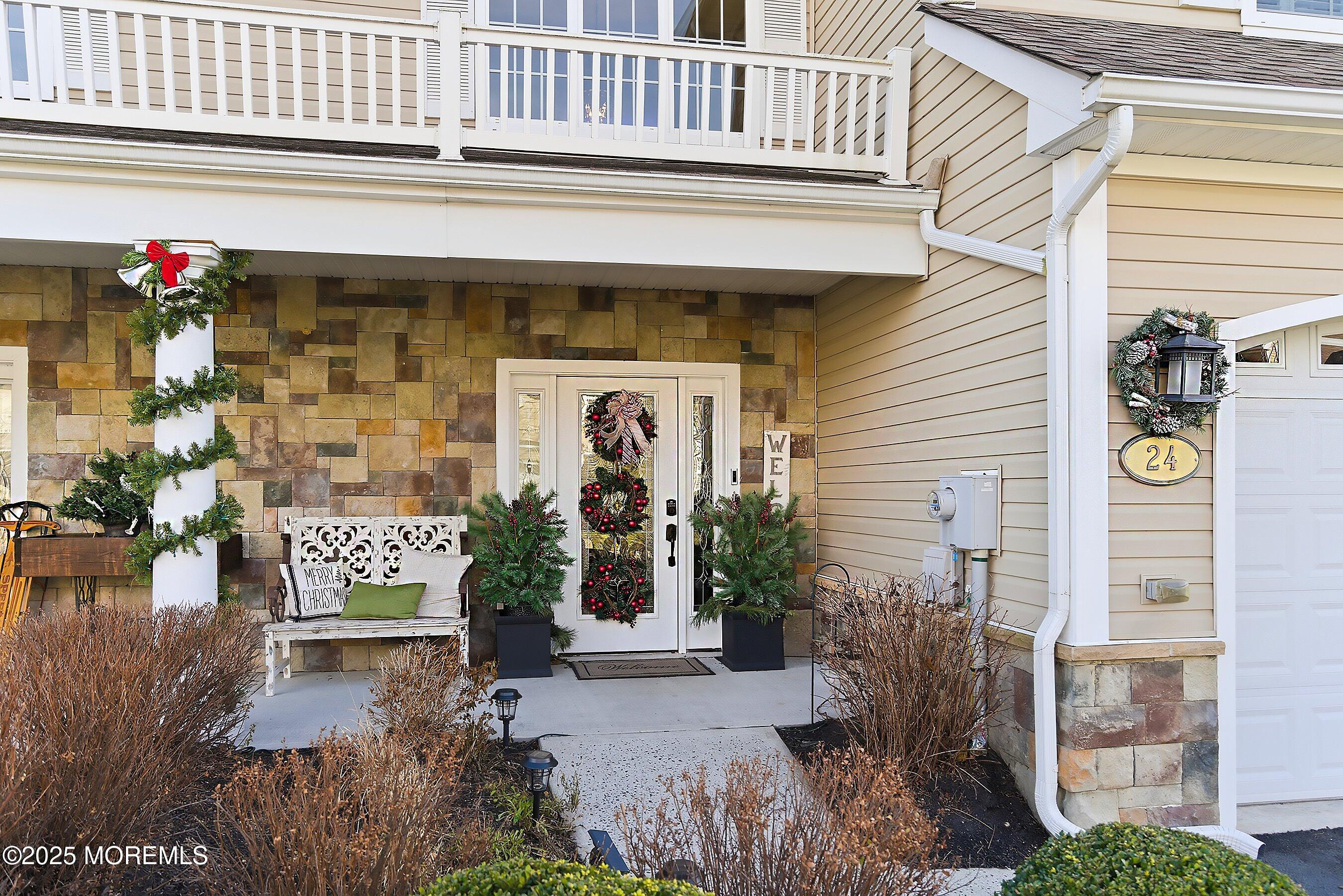 24 Abbey Road Tinton Falls, NJ 07753 - Photo 3 of 52 a front view of a building with outdoor space