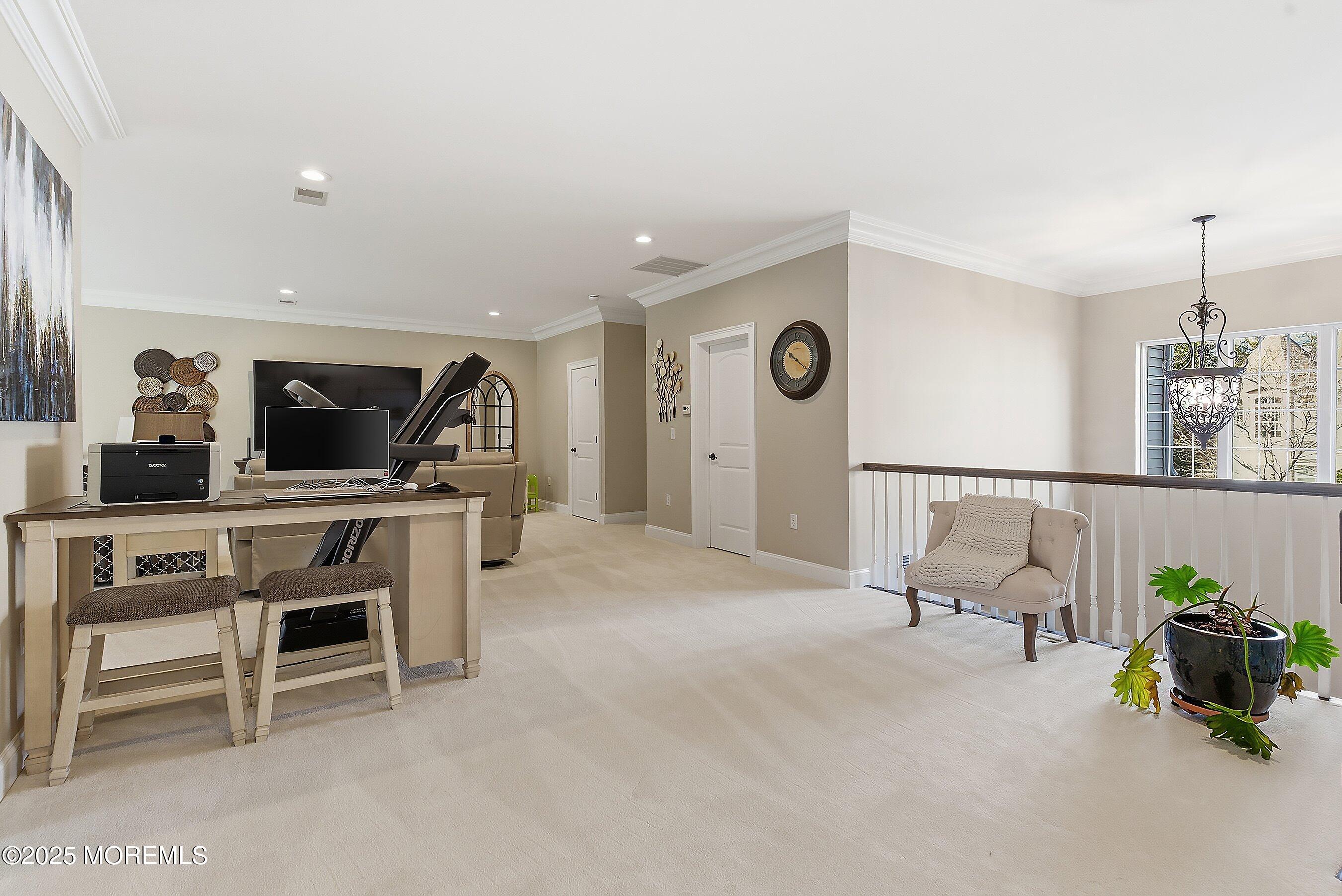 24 Abbey Road Tinton Falls, NJ 07753 - Photo 31 of 52 a living room with furniture and a flat screen tv