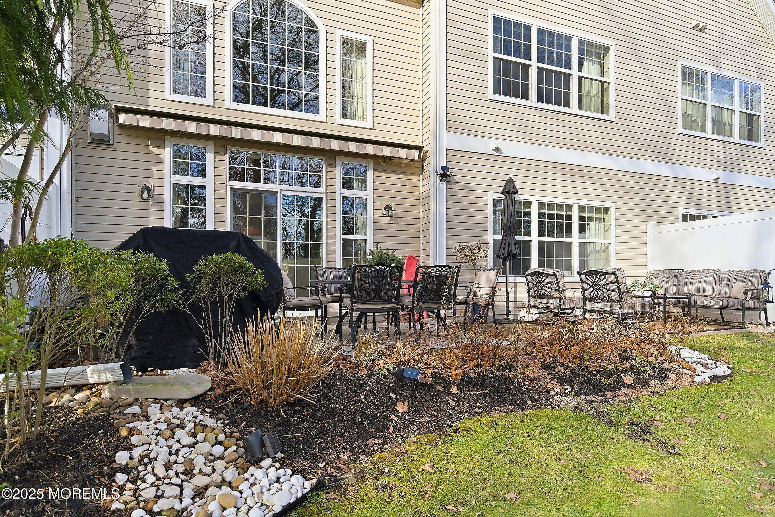 24 Abbey Road Tinton Falls, NJ 07753 - Photo 42 of 52 a view of a backyard with sitting area