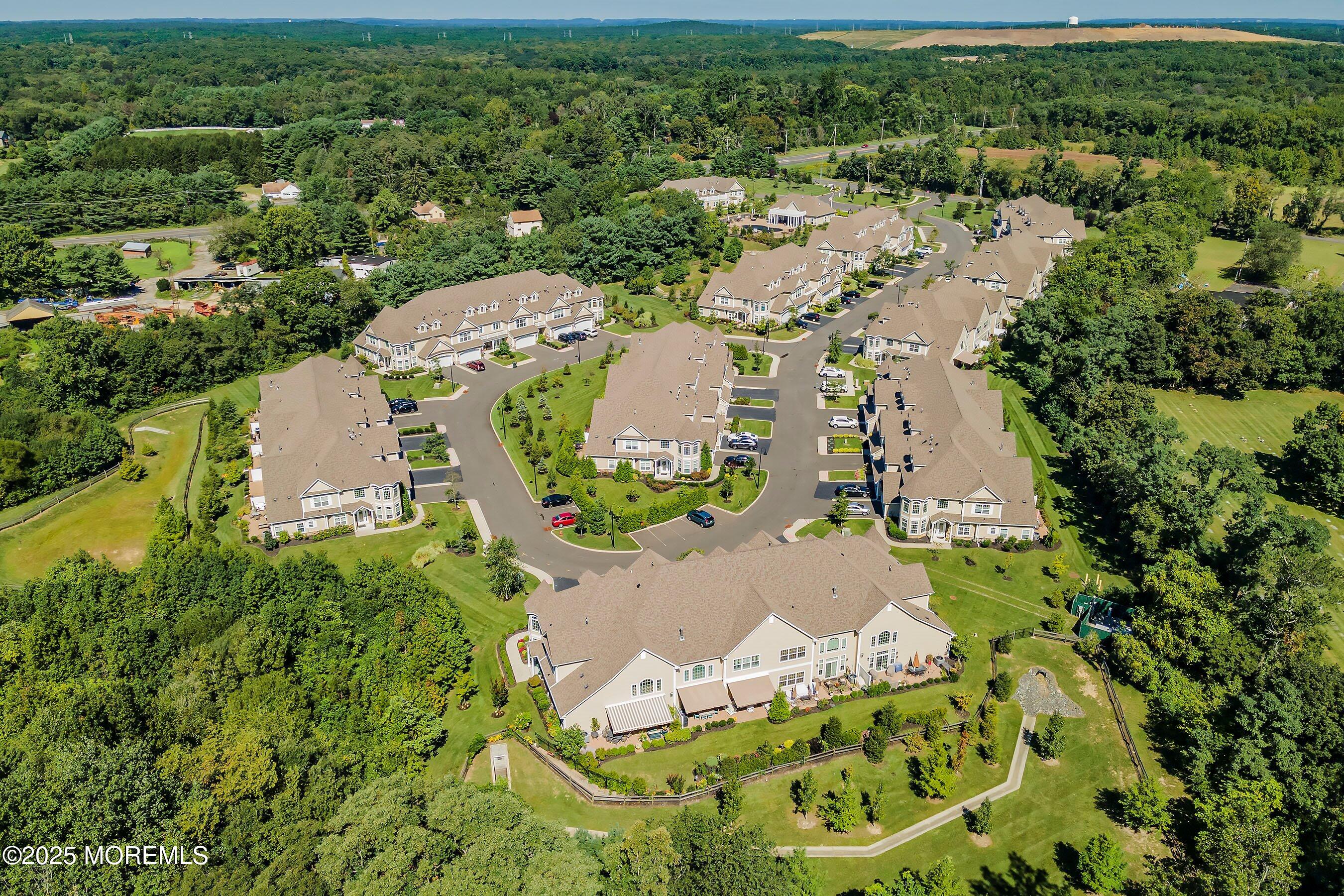 24 Abbey Road Tinton Falls, NJ 07753 - Photo 45 of 52 an aerial view of a house with a yard and lake view