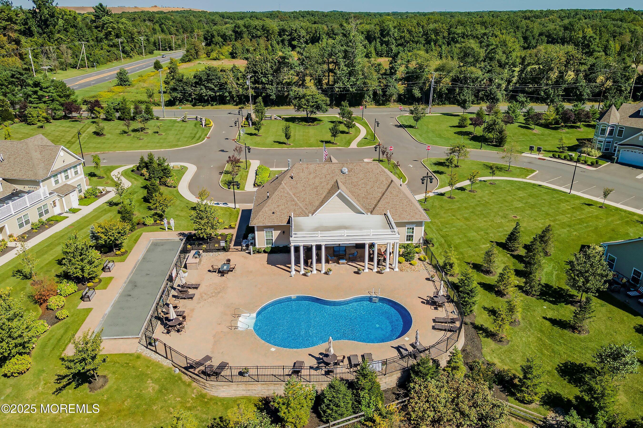 24 Abbey Road Tinton Falls, NJ 07753 - Photo 48 of 52 an aerial view of a house with yard swimming pool and outdoor seating