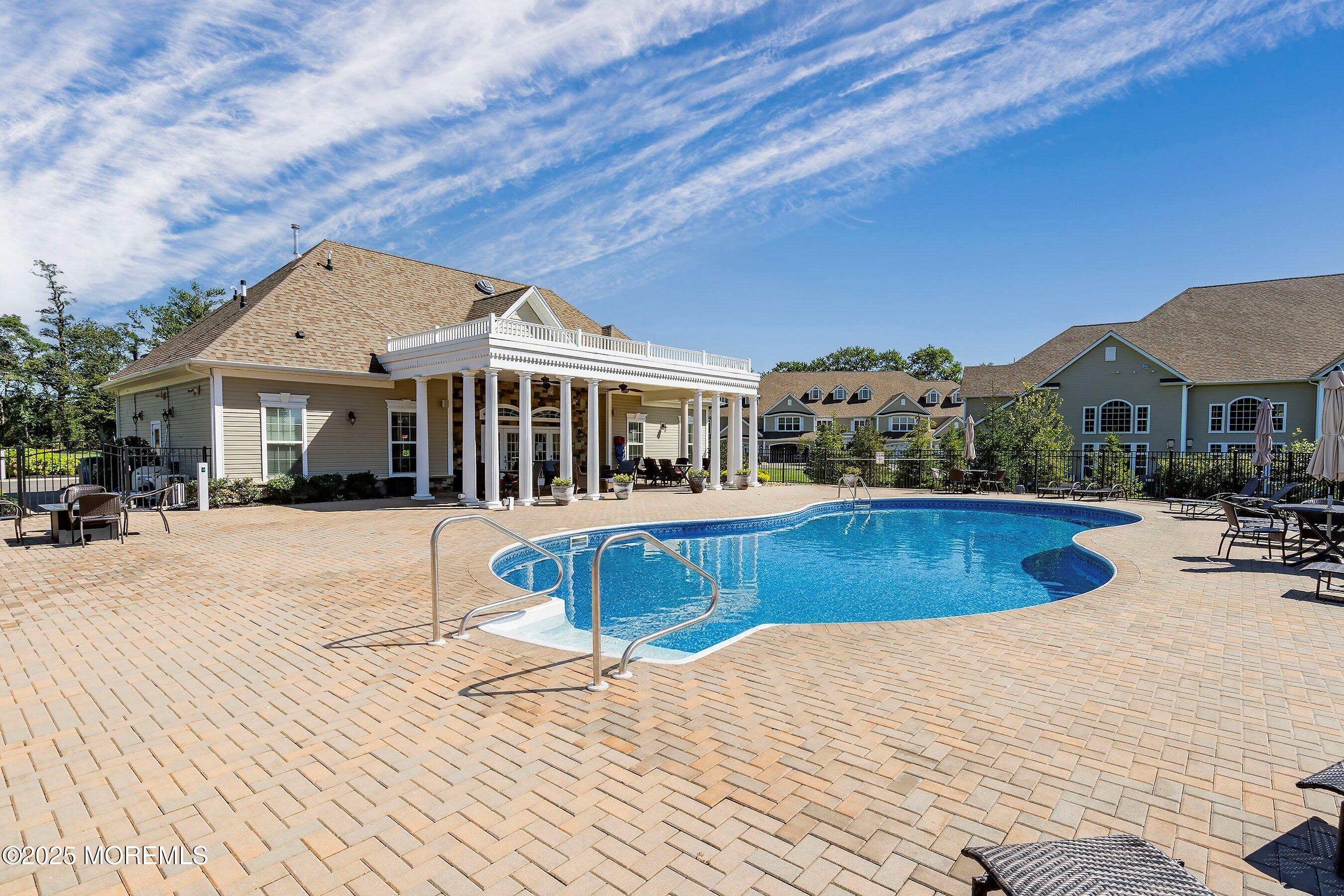 24 Abbey Road Tinton Falls, NJ 07753 - Photo 51 of 52 a front view of a house with swimming pool