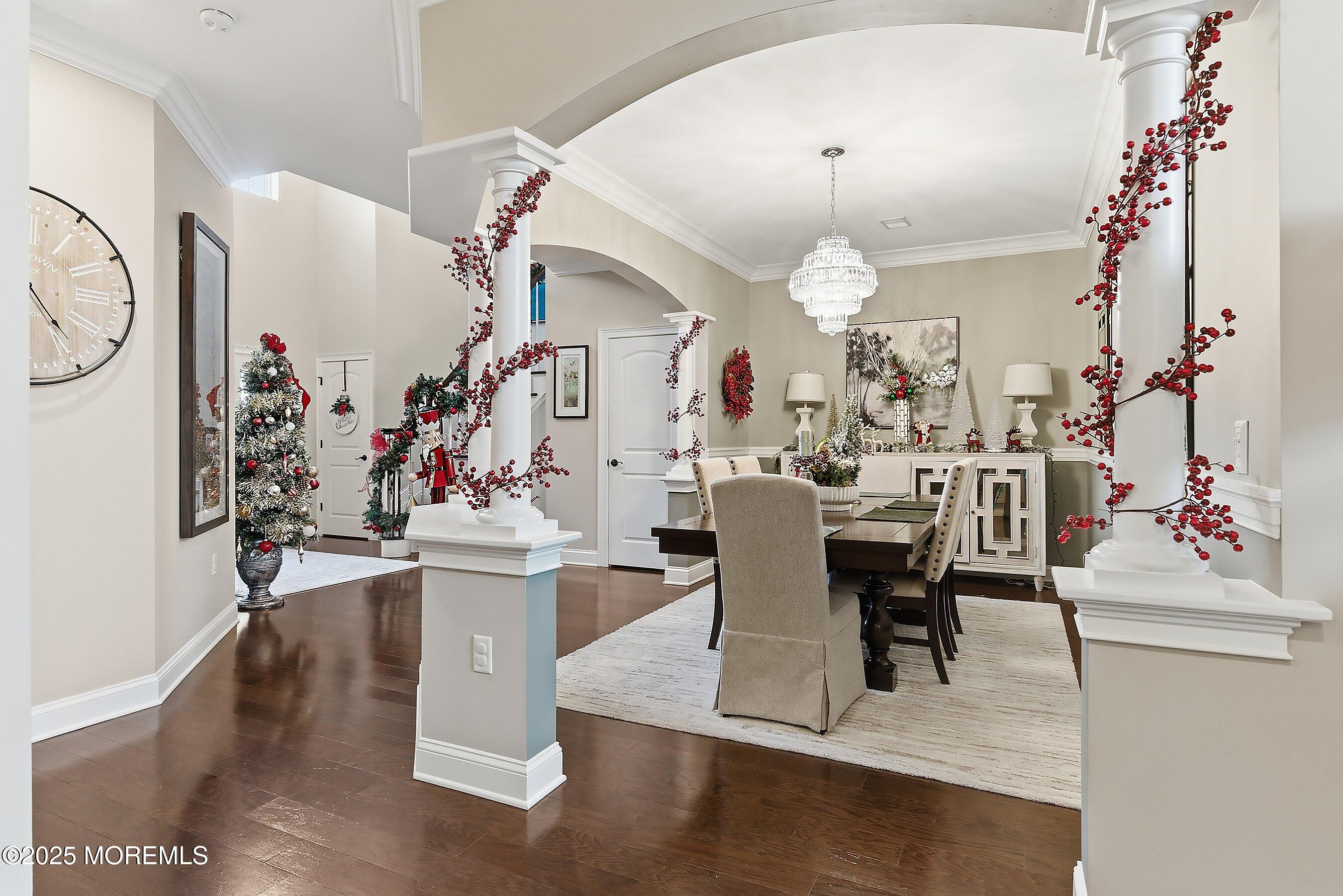 24 Abbey Road Tinton Falls, NJ 07753 - Photo 8 of 52 a view of a dining room with furniture chandelier and wooden floor
