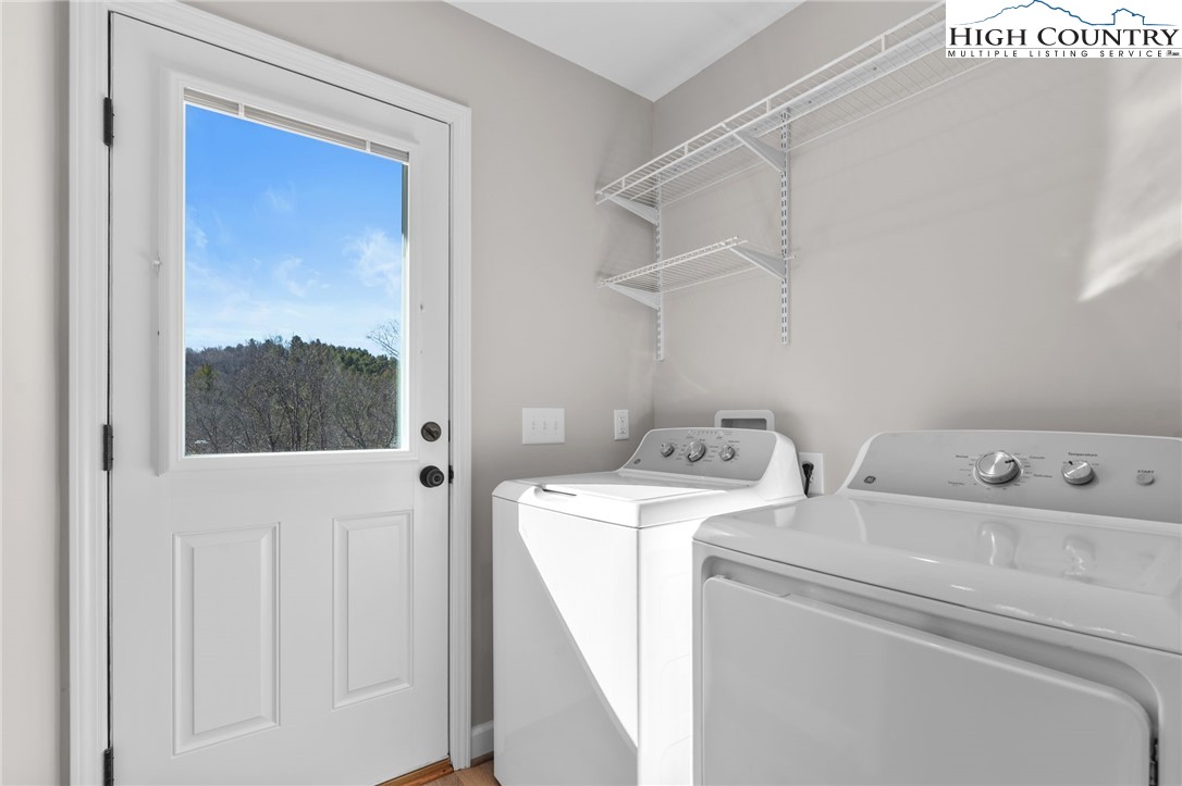 233 Ava Way, Unit 109 Boone, NC 28607 - Photo 22 of 26 a utility room with dryer and washer