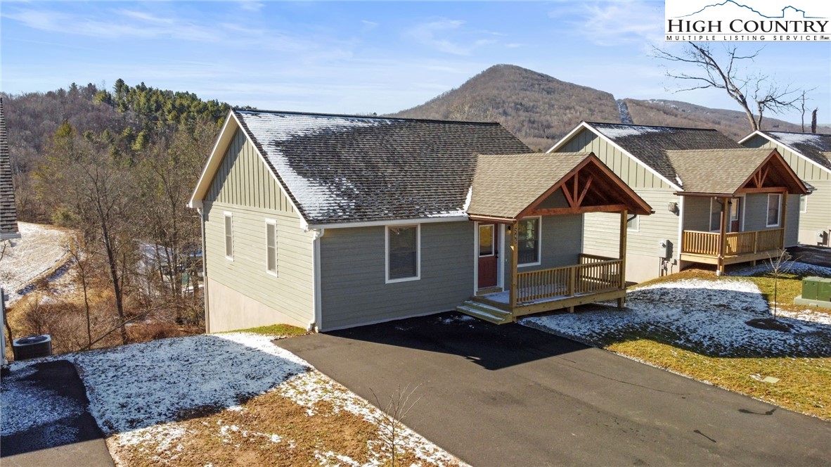 233 Ava Way, Unit 109 Boone, NC 28607 - Photo 3 of 26 a view of a house with a yard