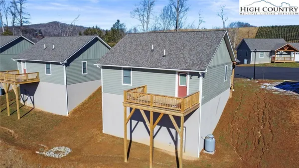 a aerial view of a house with table and chairs