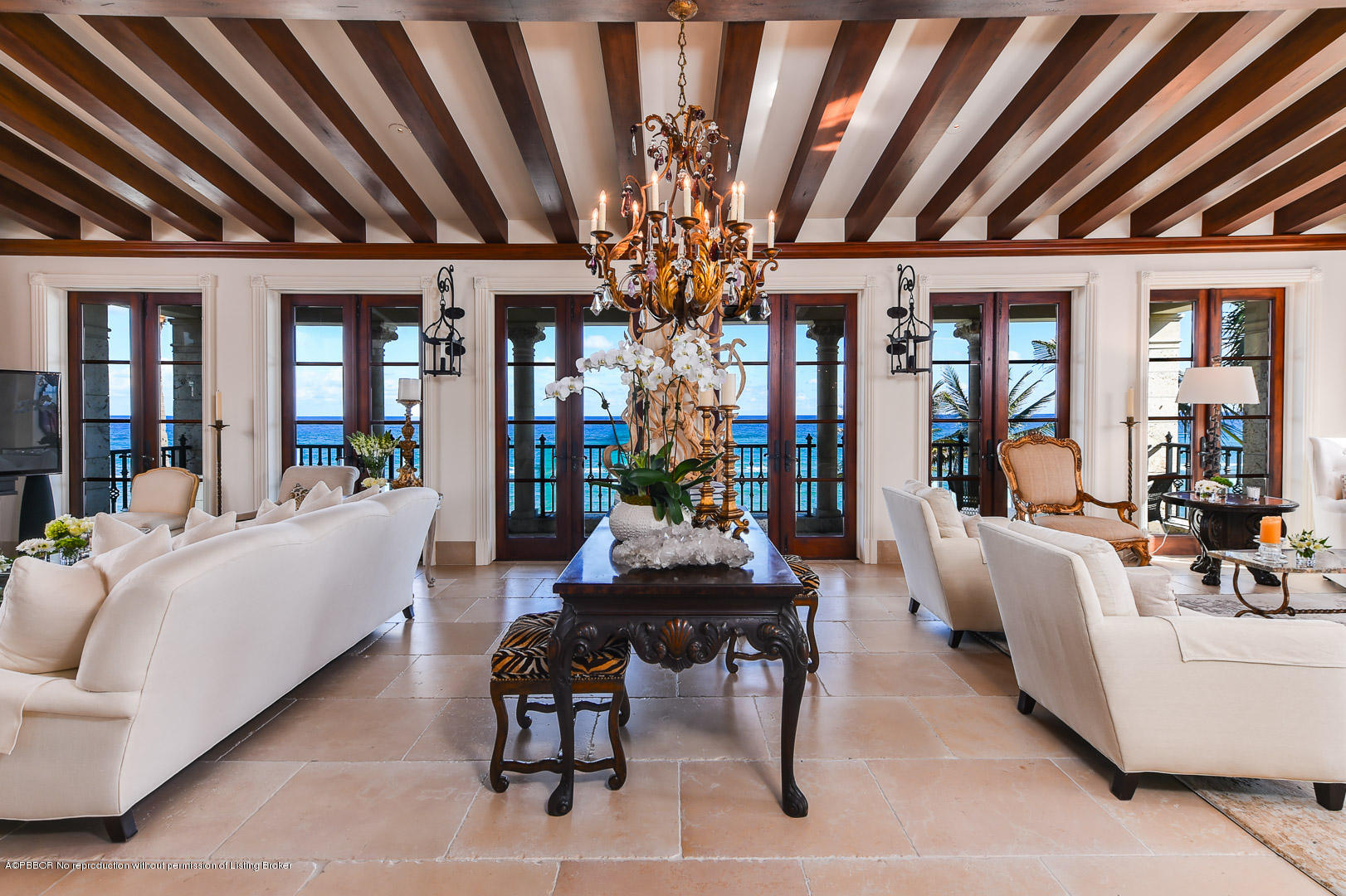104 Gulfstream Road Palm Beach, FL 33480 - Photo 14 of 60 a living room with furniture and a chandelier