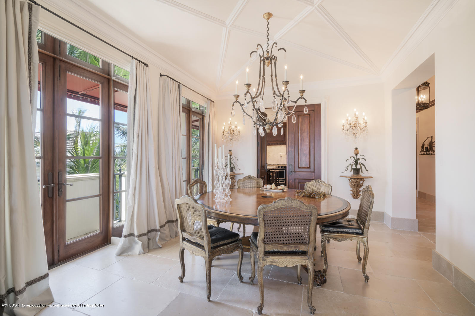 104 Gulfstream Road Palm Beach, FL 33480 - Photo 22 of 60 a view of a dining room with furniture and chandelier
