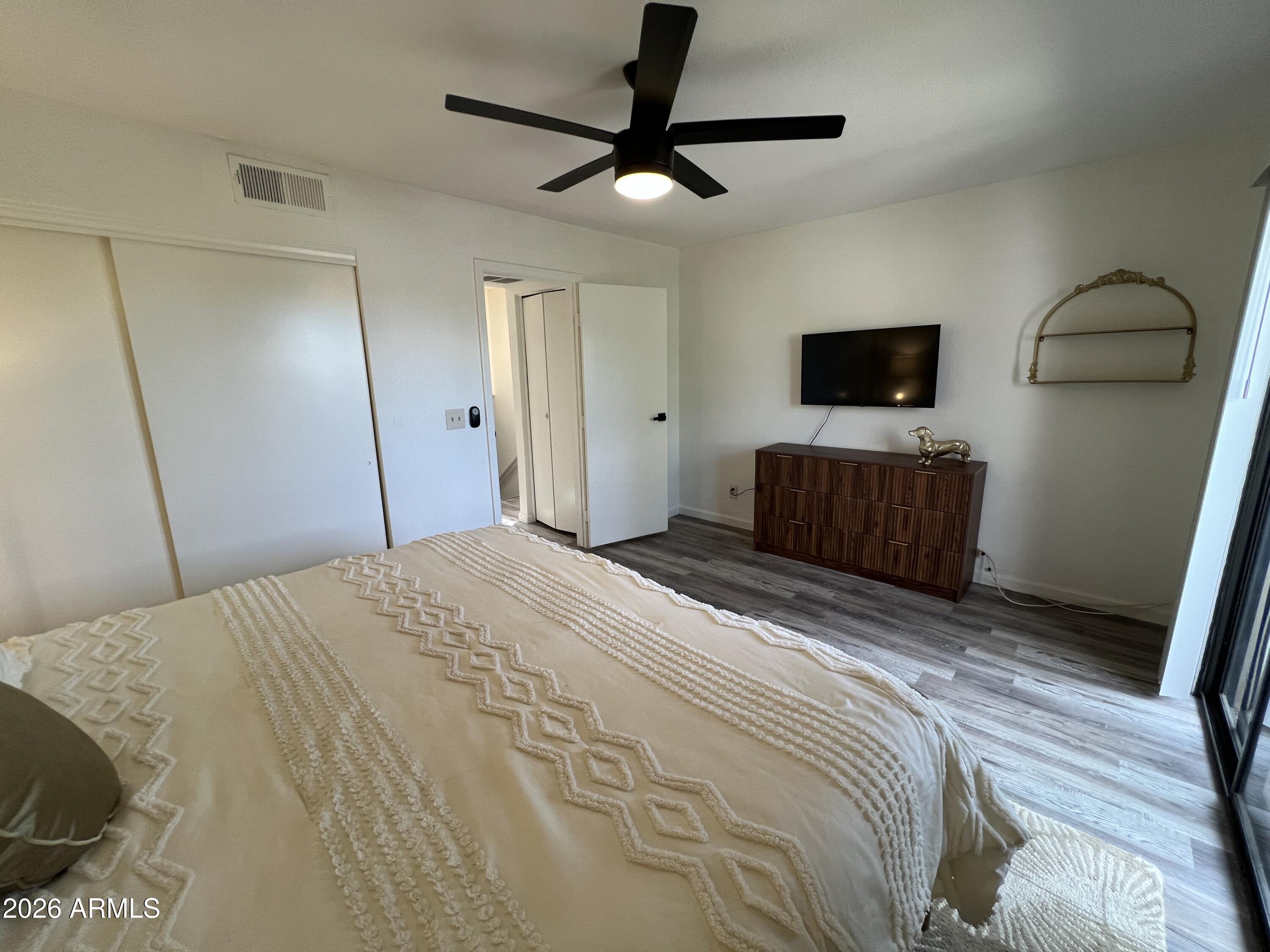 617 West 13th Street Tempe, AZ 85281 - Photo 14 of 23 a bedroom with a bed and a flat screen tv