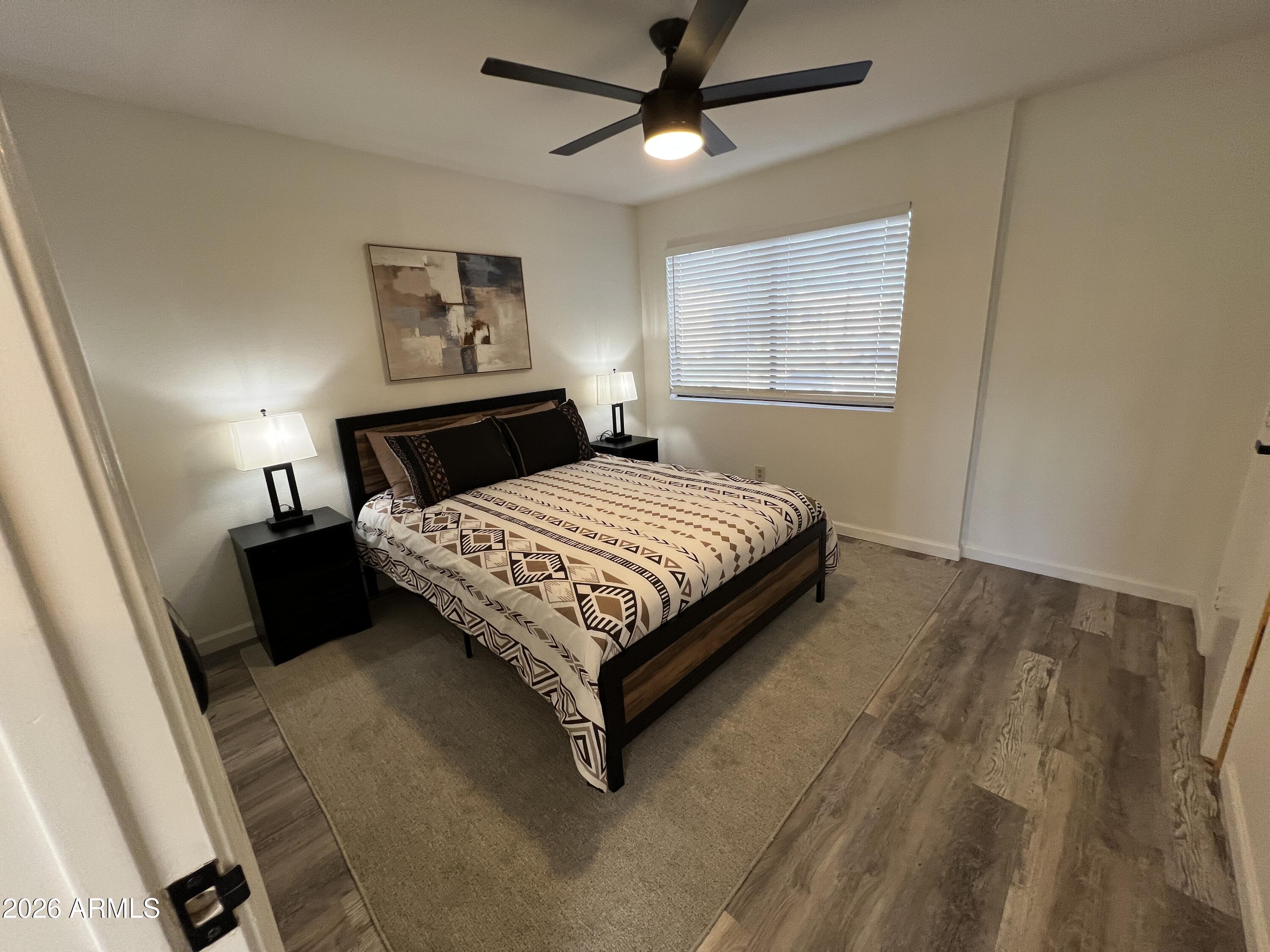 617 West 13th Street Tempe, AZ 85281 - Photo 16 of 23 a bedroom with a bed lamp and a window