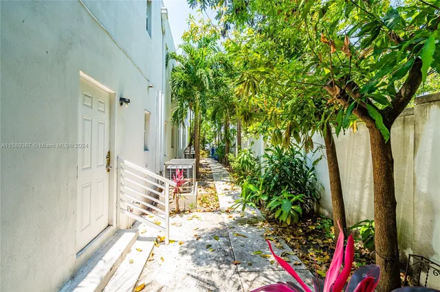 a view of entryway with wooden floor and garden
