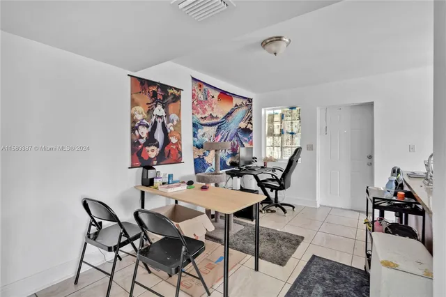 a work room with furniture and wooden floor
