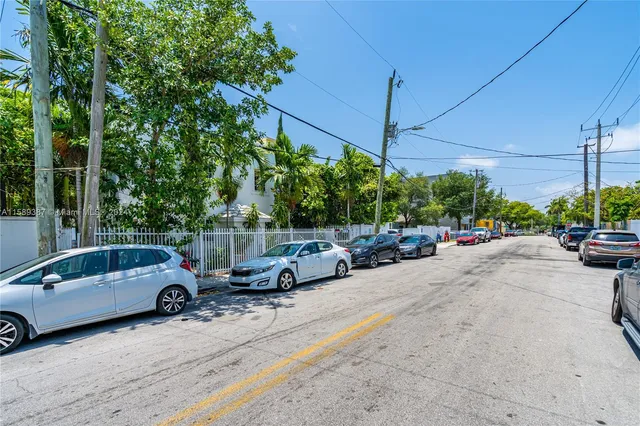 a view of a street with cars on road