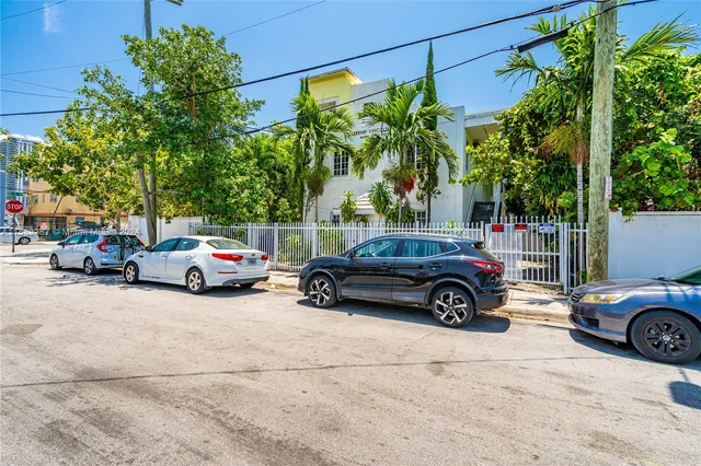 a view of car parked in front of a house