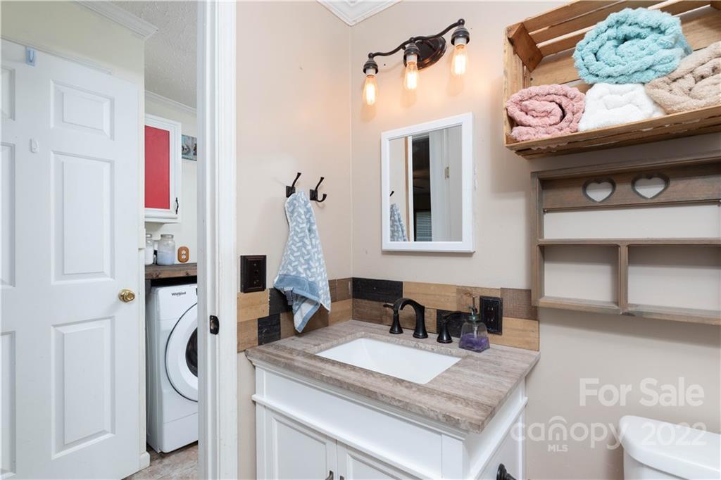 265 Whiteside Road Clover, SC 29710 - Photo 12 of 47 a bathroom with a sink and a mirror