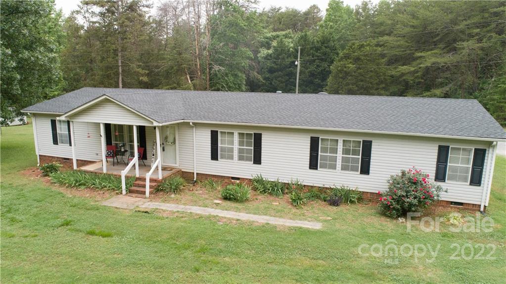 265 Whiteside Road Clover, SC 29710 - Photo 19 of 47 a front view of a house with a yard