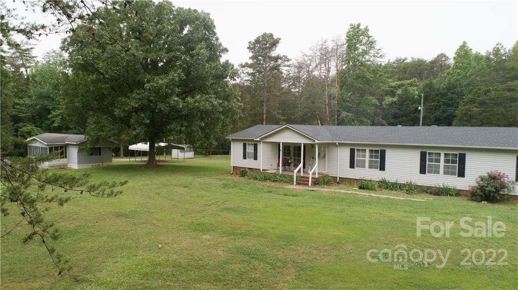 265 Whiteside Road Clover, SC 29710 - Photo 21 of 47 a front view of a house with garden