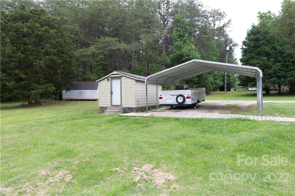 265 Whiteside Road Clover, SC 29710 - Photo 22 of 47 a front view of a house with garden