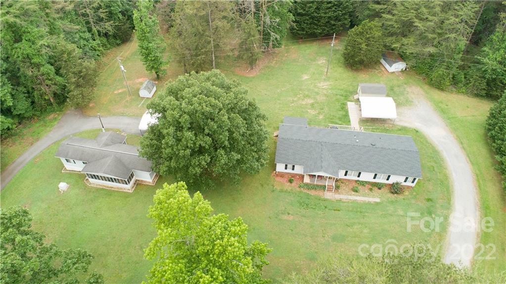 265 Whiteside Road Clover, SC 29710 - Photo 28 of 47 an aerial view of a house with swimming pool and a yard