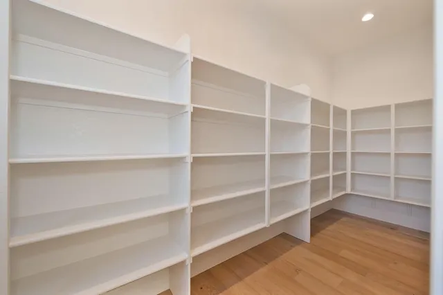 a view of room with wooden floor and closet