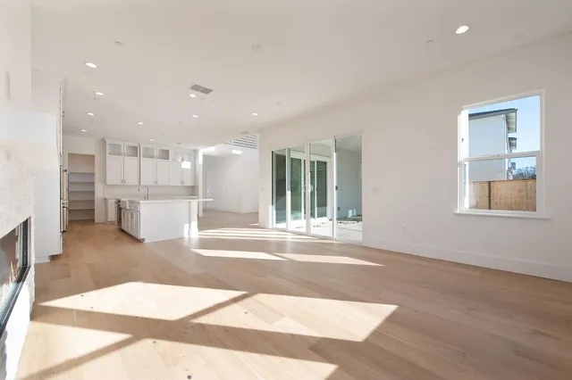 a view of a living room with a sink cabinets and a window