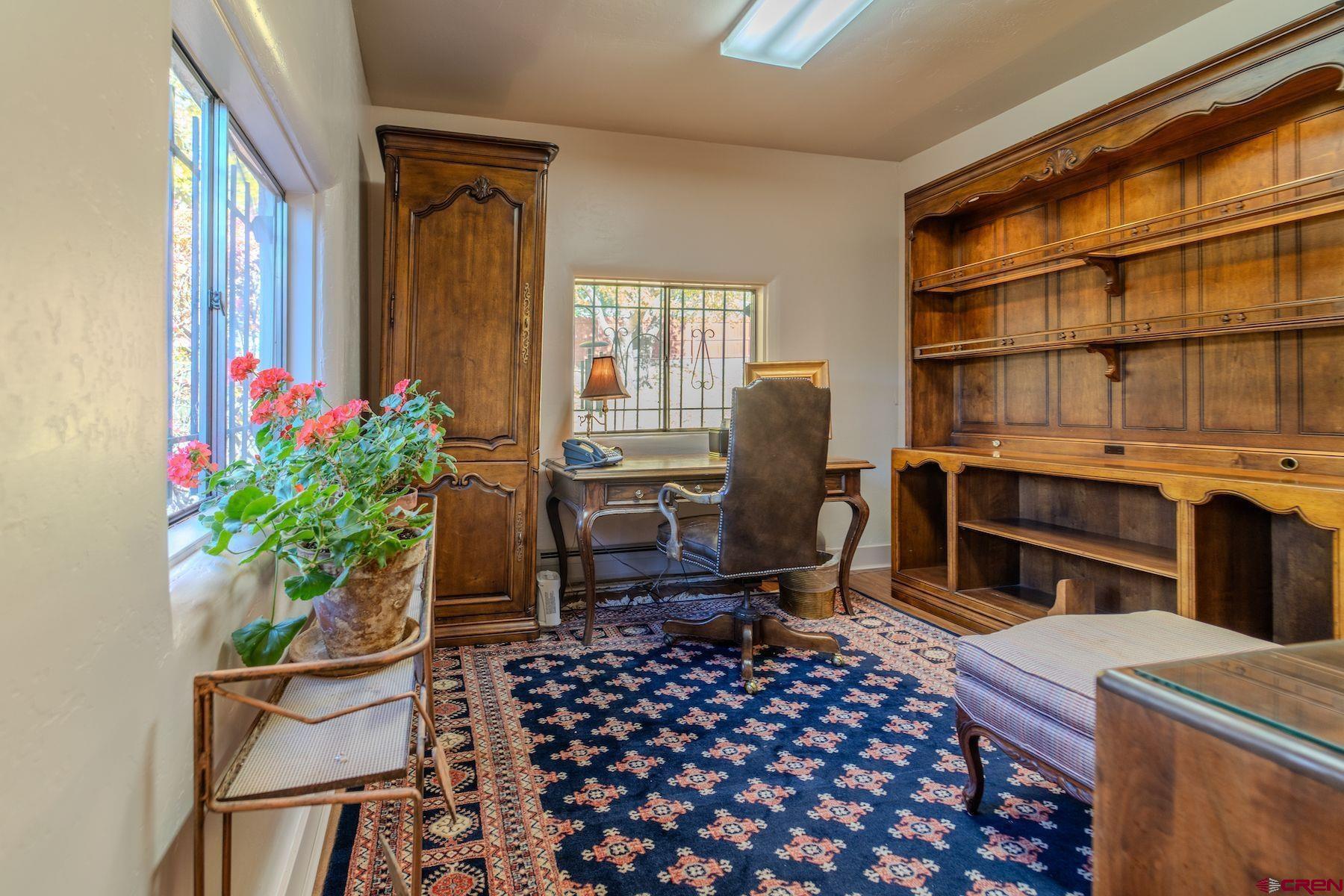 3649 Main Avenue Durango, CO 81301 - Photo 13 of 30 a living room with furniture a piano and a potted plant