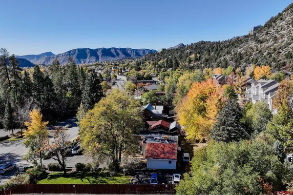 a view of a city with mountains in the background