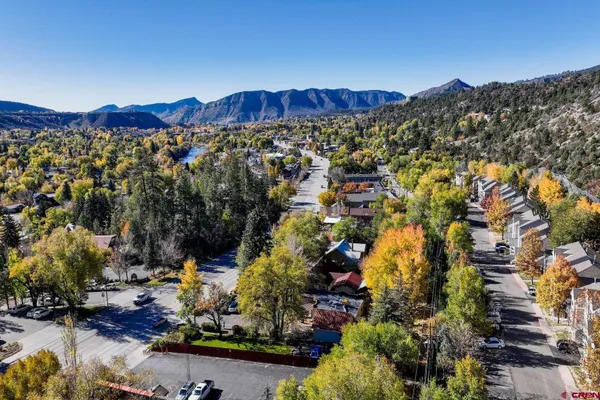 a view of a city with mountains in the background