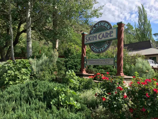 a view of sign board and green space