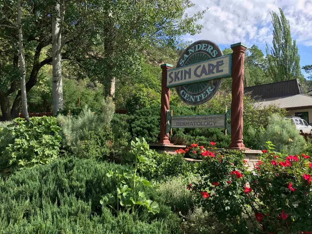 a view of sign board and green space