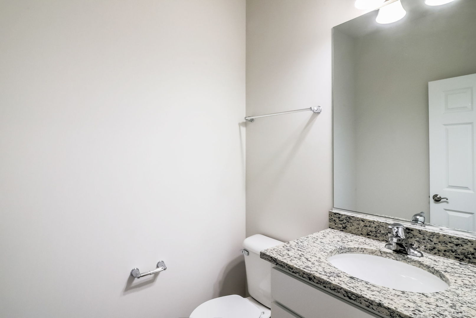 715 Maplewood Circle Elburn, IL 60119 - Photo 17 of 32 a bathroom with a granite countertop sink a mirror and a toilet
