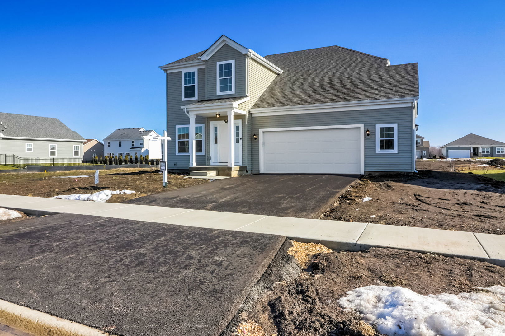 715 Maplewood Circle Elburn, IL 60119 - Photo 2 of 32 a front view of a house with a yard