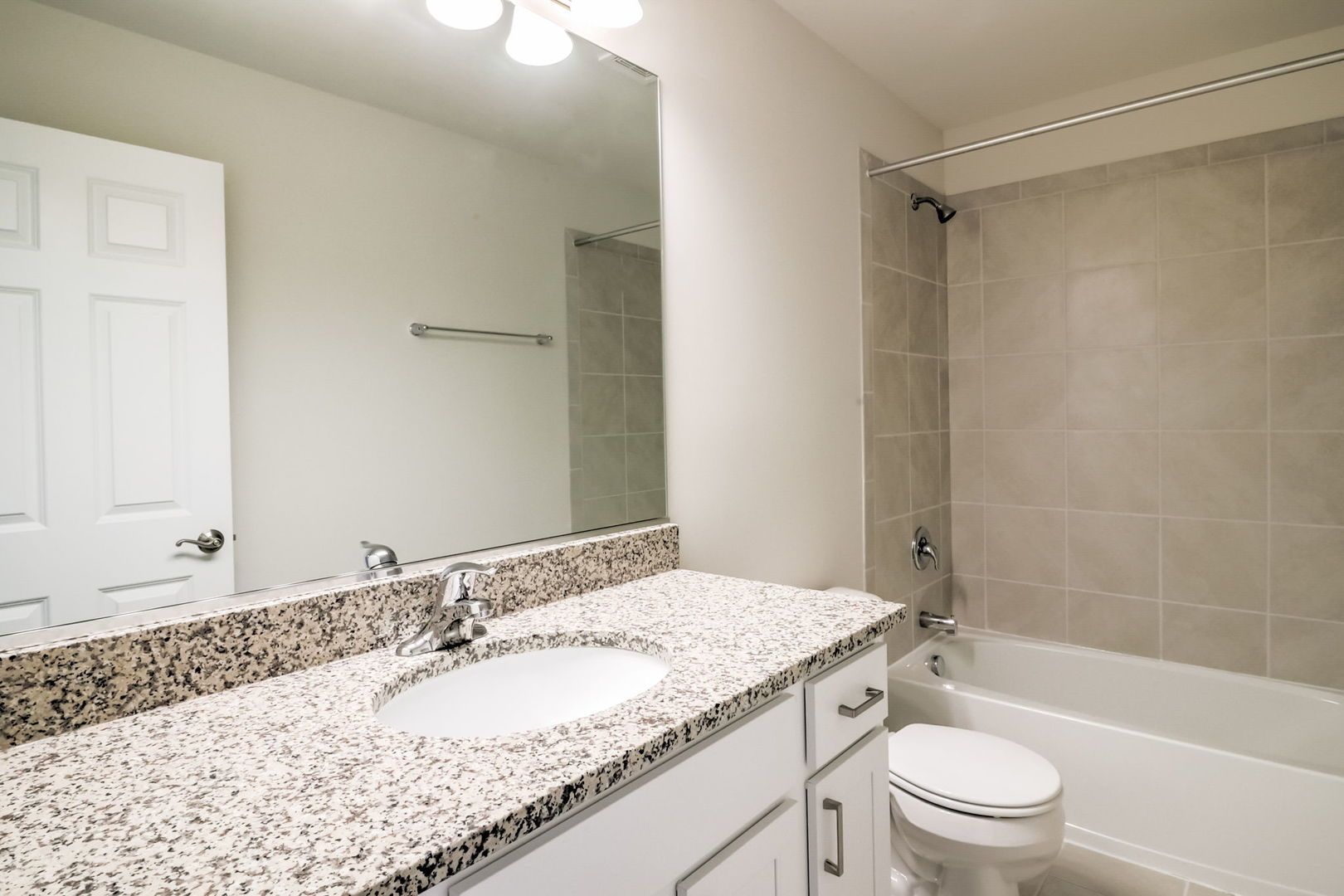 715 Maplewood Circle Elburn, IL 60119 - Photo 27 of 32 a bathroom with a granite countertop sink a toilet and shower