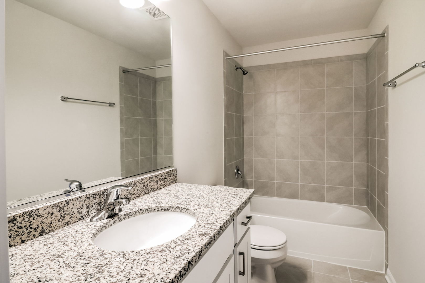 715 Maplewood Circle Elburn, IL 60119 - Photo 28 of 32 a bathroom with a granite countertop sink a toilet a mirror and shower
