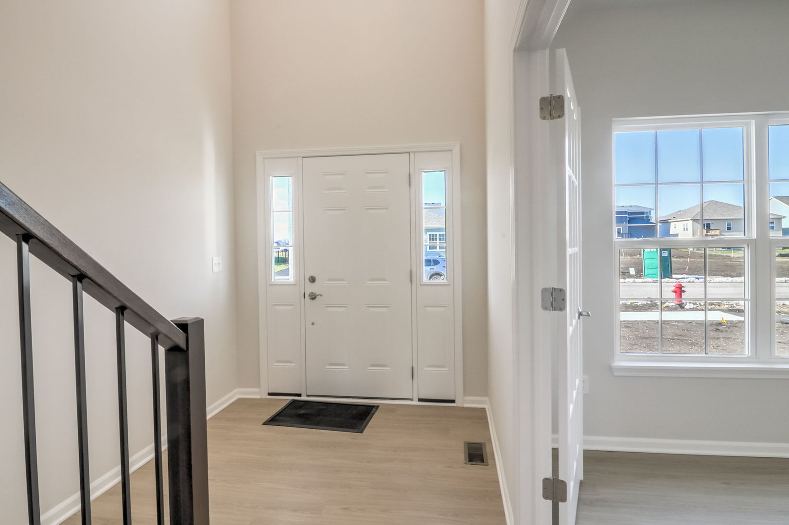 715 Maplewood Circle Elburn, IL 60119 - Photo 7 of 32 a view of a hallway with wooden floor and closet